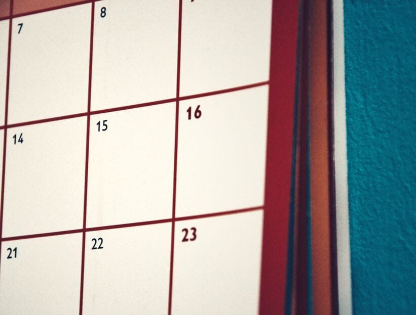 A minimalist calendar hanging on a colorful wall, perfect for planning and organization.