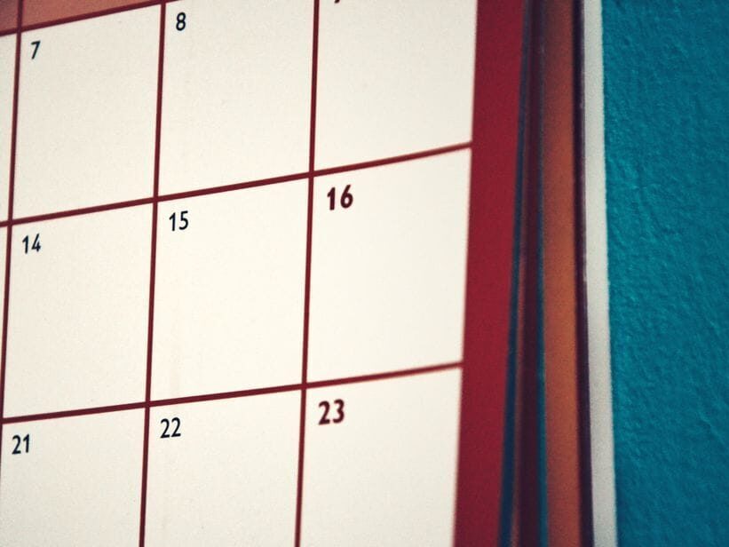 A minimalist calendar hanging on a colorful wall, perfect for planning and organization.